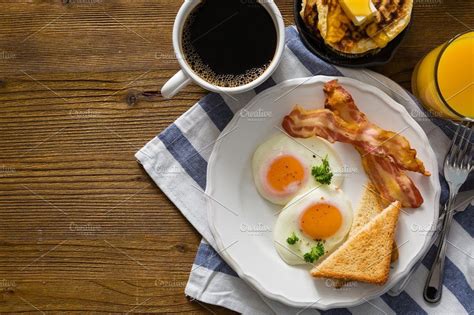 American Breakfast With Sunny Side Up Eggs Bacon Toast Pancakes