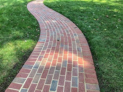 A new serpentine paver walkway fits right into established neighborhood