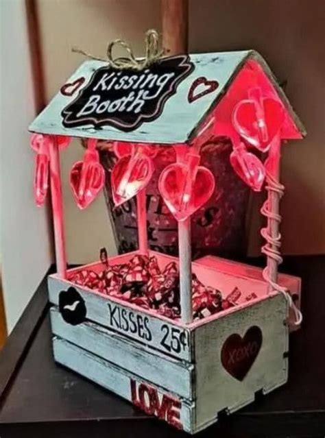 A Wooden Box With Candy In It On Top Of A Table Next To A Wall