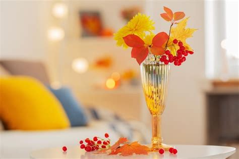 Premium Photo | Beautiful autumnal bouquet with flowers and leaves at home