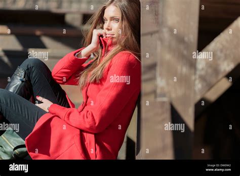 Pretty Young Woman In Red Coat Stock Photo Alamy