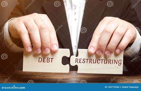 Businessman Collects Wooden Blocks with the Word Debt Restructuring ...