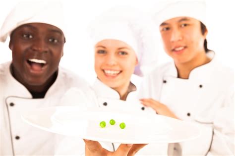 Premium Photo Portrait Of Chefs Holding Green Peas In Plate While