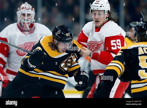 Detroit Red Wings' Tyler Bertuzzi (59) and Boston Bruins' Brad Marchand ...