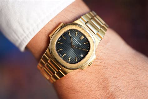 Patek Philippe Nautilus Reference In Yellow Gold Full Set And