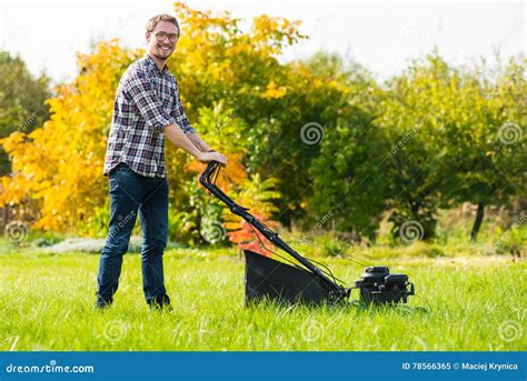 Young Man Mowing The Grass Stock Image Image Of People 78566365