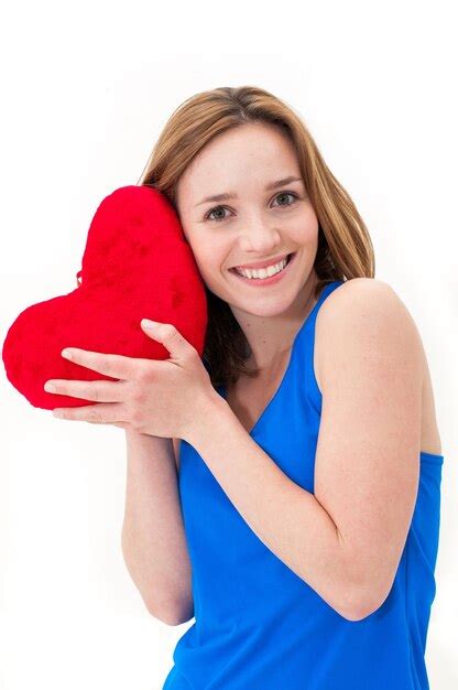 Premium Photo Beautiful Woman With Heart Shape Pillow Against White