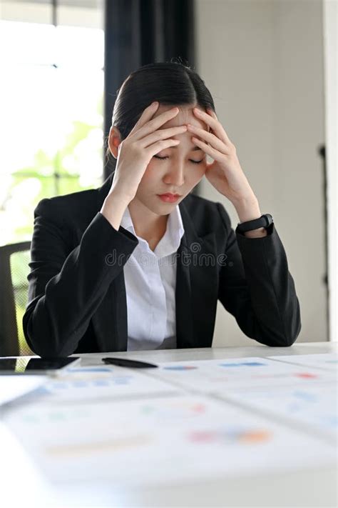 Stressed And Exhausted Asian Businesswoman Pensive Thinking A Financial