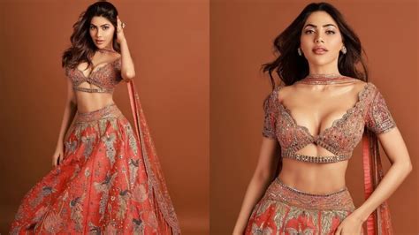 Nikki Tamboli Stuns In Plunging Blouse And Orange Lehenga Shares Hot