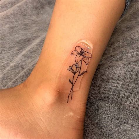 Fine Line Lily Flower Tattoo On The Ankle Lillies Tattoo Petite