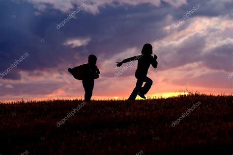 Kids running at sunset. Stock Photo by ©gjohnstonphoto 6988839