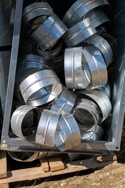 Premium Photo | Various sheet metal air ducts in stock for installation ...