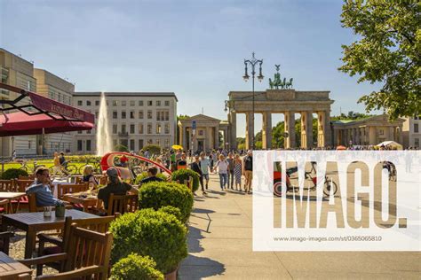 View Of Brandenburg Gate Restaurant And Visitors In Pariser Platz On