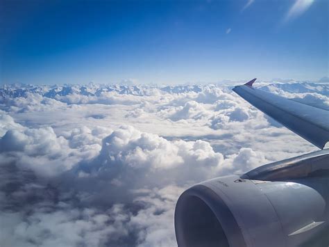 Royalty-Free photo: White commercial aircraft cruising in the sky ...