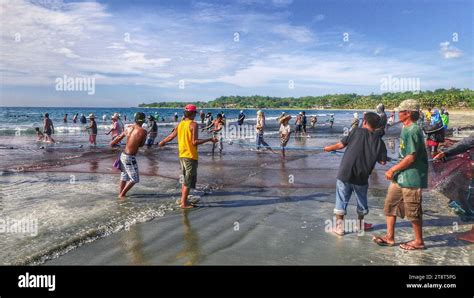 It Takes A Village Philippines Fishermen Pulling Ashore There Nets