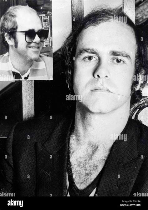 Singer Elton John gets hair back Stock Photo - Alamy