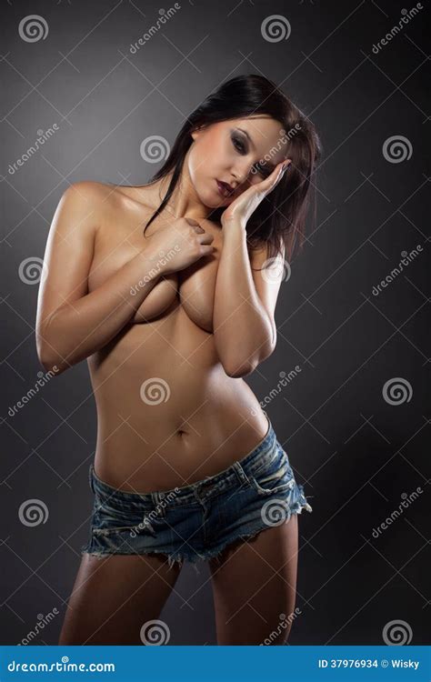 Passionate Brunette Posing Topless In Denim Shorts Stock Photo Image Of Jeans Nude