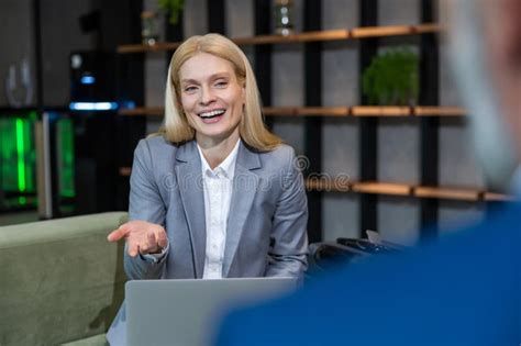 Blonde Business Woman Having An Interview With A Work Candidate And Looking Involved Stock Image