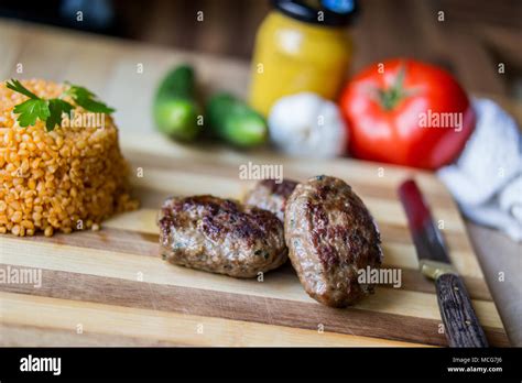 Turkish Meatball Kofte Or Kofta With Pliav Bulgur Pilaf Tomatoes And