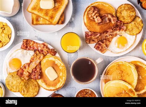 Healthy Full American Breakfast With Eggs Bacon Pancakes And Latkes