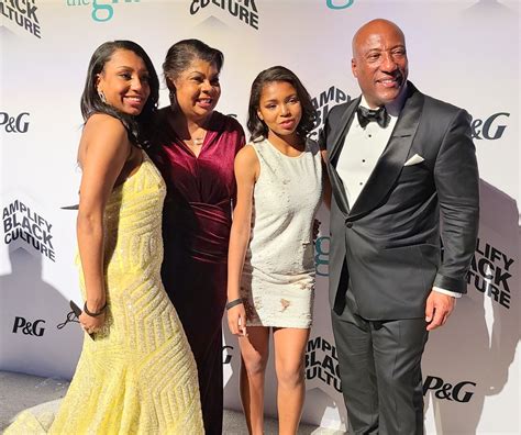 April Ryan (center) and daughters share a moment with Byron Allen ...