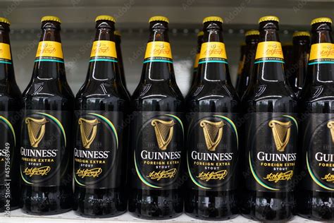 Guinness Beer on the store shelf. Guinness Draught is one the most ...