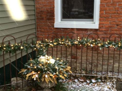 Rod Iron Fence I Bought This Fall Decorated With Greenery And Lights