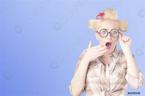 A Surprised Blonde Pin Up Girl On Blue Background Stock Photo 4449248 Crushpixel