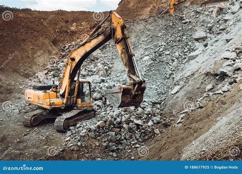 Industrial Track Type Excavator Digging At A Quarry Or A Construction