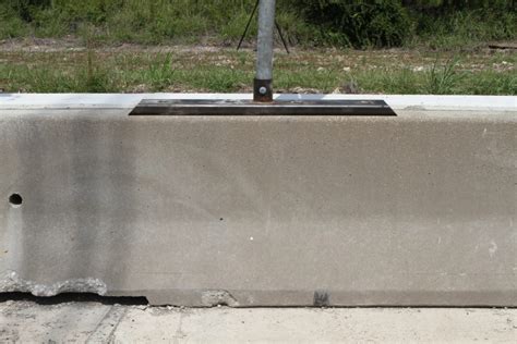 Sign on Concrete Median Barrier - Roadside Safety Pooled Fund