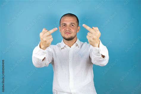 Russian Business Man Over Blue Background Showing Middle Finger Doing Fuck You Bad Expression