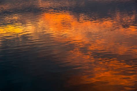 Premium Photo | Colorful sunset in water reflection