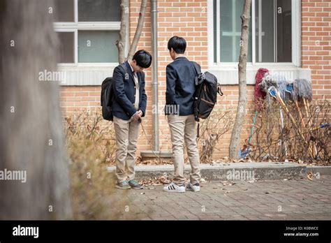 Juvenile delinquent bullying a student in school Stock Photo: 155154734 - Alamy