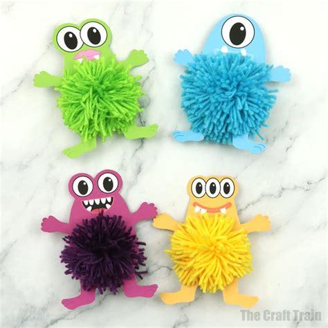 Yarn monsters made with pom poms - The Craft Train