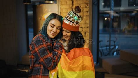 Two Cute Bisexual Women Hugging In Public Indoors Stock Image Image