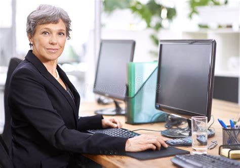 She Works Hard For A Living Portrait Of A Mature Woman Sitting In An