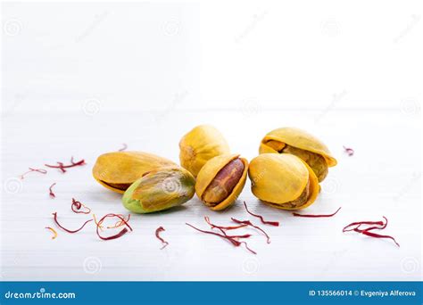 Pistachios In Yellow Shells Roasted With Saffron And Dried Saffron