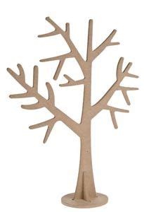 A Wooden Cutout Of A Tree On A White Background