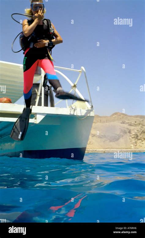 A Scuba Diver Jumping Into The Red Sea From A Dive Boat Stock Photo Alamy