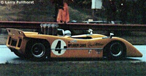 Yellow Race Car With Number Four Mclaren M8a Mclaren Formula 1 1969