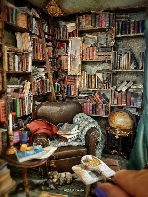 A Room Filled With Lots Of Books Next To A Chair And Table In Front Of