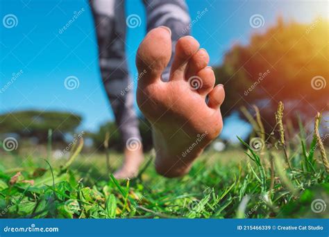 Barefoot Walking. Closeup of Woman Running Barefoot in the Park on ...