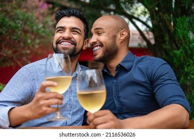 Romantic Gay Couple Smiling Drinking Wine Stock Photo 2116536026
