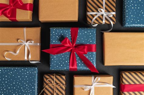 Premium Photo Christmas Gift Boxes With Ribbon And Bows On Black