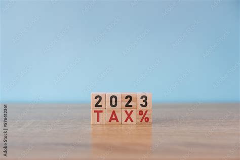 Tax and 2023 number on wooden block. Pay tax in 2023 years. The new ...