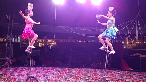 Girls On Unicycle Juggling And Balancing Bowls On Head Circus Circus