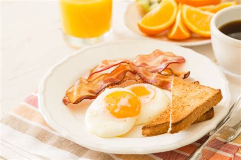 American Breakfast With Sunny Side Up Eggs Bacon Toast Pancakes