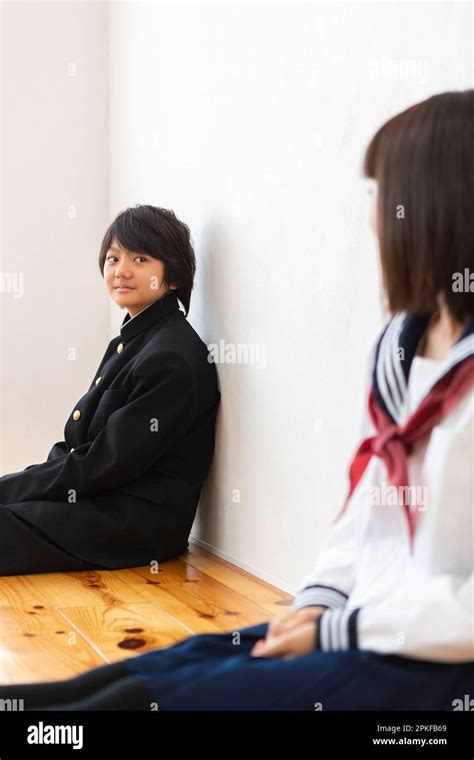 Junior High School Student Sitting On The Floor Stock Photo Alamy