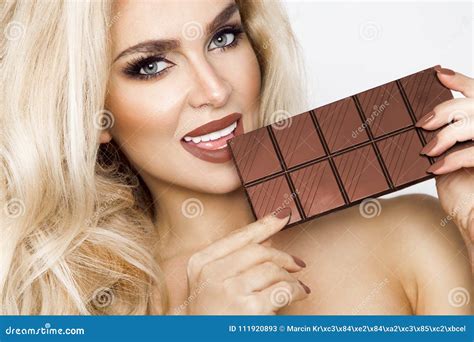 Beautiful Blonde Women With Green Eyes Sensually Eating Tasty Chocolate Stock Image Image Of