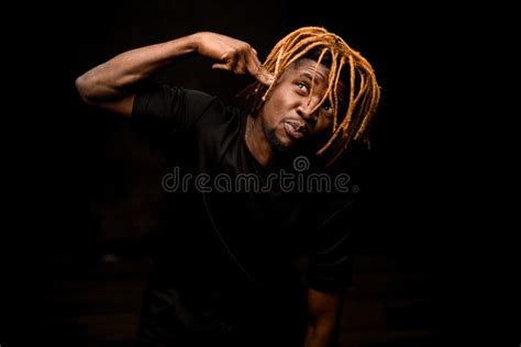 Naked Black Guy With Blonde Dreadlocks Posing In The Studio Looking At Camera Stock Image